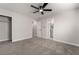 Spacious bedroom featuring neutral walls, plush carpet, and walk-in closet at 113 Elm St, Henderson, NV 89015