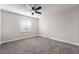 Neutral bedroom features plush carpet, ceiling fan, and a bright window at 113 Elm St, Henderson, NV 89015
