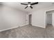 Bedroom with soft carpet, closet, ceiling fan, and neutral-colored walls at 113 Elm St, Henderson, NV 89015