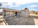 Inviting single-story gray home with a covered front porch and a spacious driveway at 113 Elm St, Henderson, NV 89015