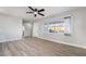 Spacious living room with modern light hardwood floors and light gray paint at 113 Elm St, Henderson, NV 89015