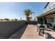 Private backyard featuring a patio with grilling area, pavers, desert landscaping, and ample space at 1352 Angel Falls St, Las Vegas, NV 89142