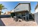 Back exterior featuring a covered patio, BBQ area, well maintained landscape, and ample entertainment space at 1352 Angel Falls St, Las Vegas, NV 89142