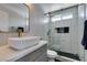 Stylish bathroom featuring a walk-in shower and vessel sink with modern fixtures and sleek vanity at 1352 Angel Falls St, Las Vegas, NV 89142
