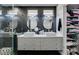 Modern bathroom featuring dual vessel sinks, sleek vanity, and a glass-enclosed shower at 1352 Angel Falls St, Las Vegas, NV 89142