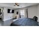 Bedroom featuring a large bed, ceiling fan, and well-lit windows for a comfortable ambiance at 1352 Angel Falls St, Las Vegas, NV 89142
