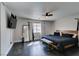 Cozy bedroom with a dark bedspread, modern decor, and a ceiling fan for added comfort at 1352 Angel Falls St, Las Vegas, NV 89142