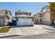 Charming two-story house boasting a well-manicured lawn, desert landscaping, and a convenient two-car garage at 1352 Angel Falls St, Las Vegas, NV 89142