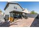 Back exterior featuring covered patio, BBQ area, desert landscape, and ample entertainment space at 1352 Angel Falls St, Las Vegas, NV 89142