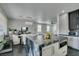 Bright open concept kitchen with island and modern cabinetry with view into dining and living areas at 1352 Angel Falls St, Las Vegas, NV 89142
