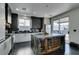 Modern kitchen features stainless steel appliances, sleek cabinetry, and a center island with a built-in wine rack at 1352 Angel Falls St, Las Vegas, NV 89142