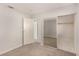 Bright bedroom features plush carpet, large mirrored closet, and convenient access to the hallway at 1704 Kismet Cir, Las Vegas, NV 89108