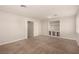 Spacious bedroom with neutral carpet, built in shelving and an entry to another room at 1704 Kismet Cir, Las Vegas, NV 89108