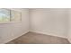 A bedroom with carpeted floors, a window, and neutral walls at 1704 Kismet Cir, Las Vegas, NV 89108
