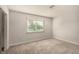 A bedroom features carpeted floors and a window at 1704 Kismet Cir, Las Vegas, NV 89108
