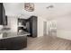 Modern kitchen featuring dark cabinets, stainless steel appliances, and new flooring, creating a modern space at 1704 Kismet Cir, Las Vegas, NV 89108