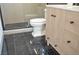 Bathroom with modern vanity, toilet, and sleek shower featuring black hexagon tiling at 1805 Amboy Dr, Las Vegas, NV 89108