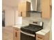 Close up of a renovated kitchen with modern appliances and marble countertops at 1805 Amboy Dr, Las Vegas, NV 89108