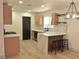 Modern kitchen with sleek white marble counters and eat-in kitchen island at 1805 Amboy Dr, Las Vegas, NV 89108