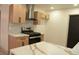 Modern kitchen with stainless steel appliances and an island with marble countertops at 1805 Amboy Dr, Las Vegas, NV 89108