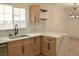 Bright kitchen featuring marble countertops, stainless steel sink, and updated cabinetry at 1805 Amboy Dr, Las Vegas, NV 89108