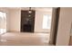 Bright living room featuring a modern fireplace, sleek floors and sliding glass doors at 1805 Amboy Dr, Las Vegas, NV 89108