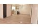 Open-concept living space with hardwood floors and eat-in kitchen with counter seating at 1805 Amboy Dr, Las Vegas, NV 89108