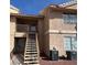 Two-story apartment building with outside stairs and an air conditioning unit at 1830 N Pecos Rd # 252, Las Vegas, NV 89115
