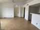 Bright living room with tile floors, vaulted ceiling, and an open layout leading to other rooms at 1830 N Pecos Rd # 252, Las Vegas, NV 89115