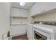 Laundry room featuring a sink, counter, and modern washer and dryer at 2777 Paradise Rd # 2001, Las Vegas, NV 89109