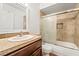 Bathroom with tile shower and a dark wood vanity at 2898 Violet Ln # 0, Henderson, NV 89074