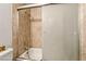 Bathroom with sliding glass shower door and tile walls at 2898 Violet Ln # 0, Henderson, NV 89074