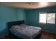 Comfortable bedroom featuring hardwood floors and a large window at 2898 Violet Ln # 0, Henderson, NV 89074