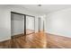 Bedroom boasts hardwood floors, mirrored closet, and neutral walls at 2898 Violet Ln # 0, Henderson, NV 89074