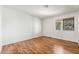 Bright bedroom with hardwood floors and a window at 2898 Violet Ln # 0, Henderson, NV 89074