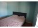 Bedroom with blue walls and bright window at 2898 Violet Ln # 0, Henderson, NV 89074
