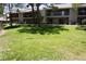 Exterior shot of a residential building with multiple balconies and a well-maintained lawn at 2898 Violet Ln # 0, Henderson, NV 89074