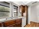 Kitchen features wood cabinets, granite counters and stainless steel sink at 2898 Violet Ln # 0, Henderson, NV 89074