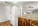 Kitchen features wood cabinets, granite counters and a white refrigerator at 2898 Violet Ln # 0, Henderson, NV 89074