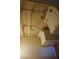 Efficient laundry area features a stacked washer and dryer and wire shelving at 2898 Violet Ln # 0, Henderson, NV 89074