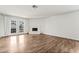 Bright living room features a brick fireplace and double doors to the backyard at 2898 Violet Ln # 0, Henderson, NV 89074