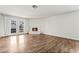 Bright living room features a brick fireplace and double doors to the backyard at 2898 Violet Ln # 0, Henderson, NV 89074