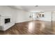 Open living room features a brick fireplace and an eat-in kitchen at 2898 Violet Ln # 0, Henderson, NV 89074