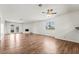 Bright living room with hardwood floors, ceiling fan, fireplace and French doors at 2898 Violet Ln # 0, Henderson, NV 89074