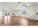 Bright living room with hardwood floors, ceiling fan, fireplace and French doors at 2898 Violet Ln # 0, Henderson, NV 89074