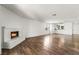 Open living room features a brick fireplace and an eat-in kitchen at 2898 Violet Ln # 0, Henderson, NV 89074