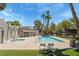 This is a community pool and jacuzzi surrounded by lounge chairs at 2898 Violet Ln # 0, Henderson, NV 89074