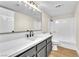 Modern bathroom features an extended countertop, vanity, shower over tub and bright lighting at 2964 Juniper Hills Blvd # 104, Las Vegas, NV 89142
