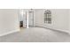 Bright bedroom includes carpeted floors, baseboard trim, and ensuite bath with a large arched window at 2964 Juniper Hills Blvd # 104, Las Vegas, NV 89142