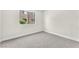 Cozy carpeted bedroom with window views and bright interior at 2964 Juniper Hills Blvd # 104, Las Vegas, NV 89142